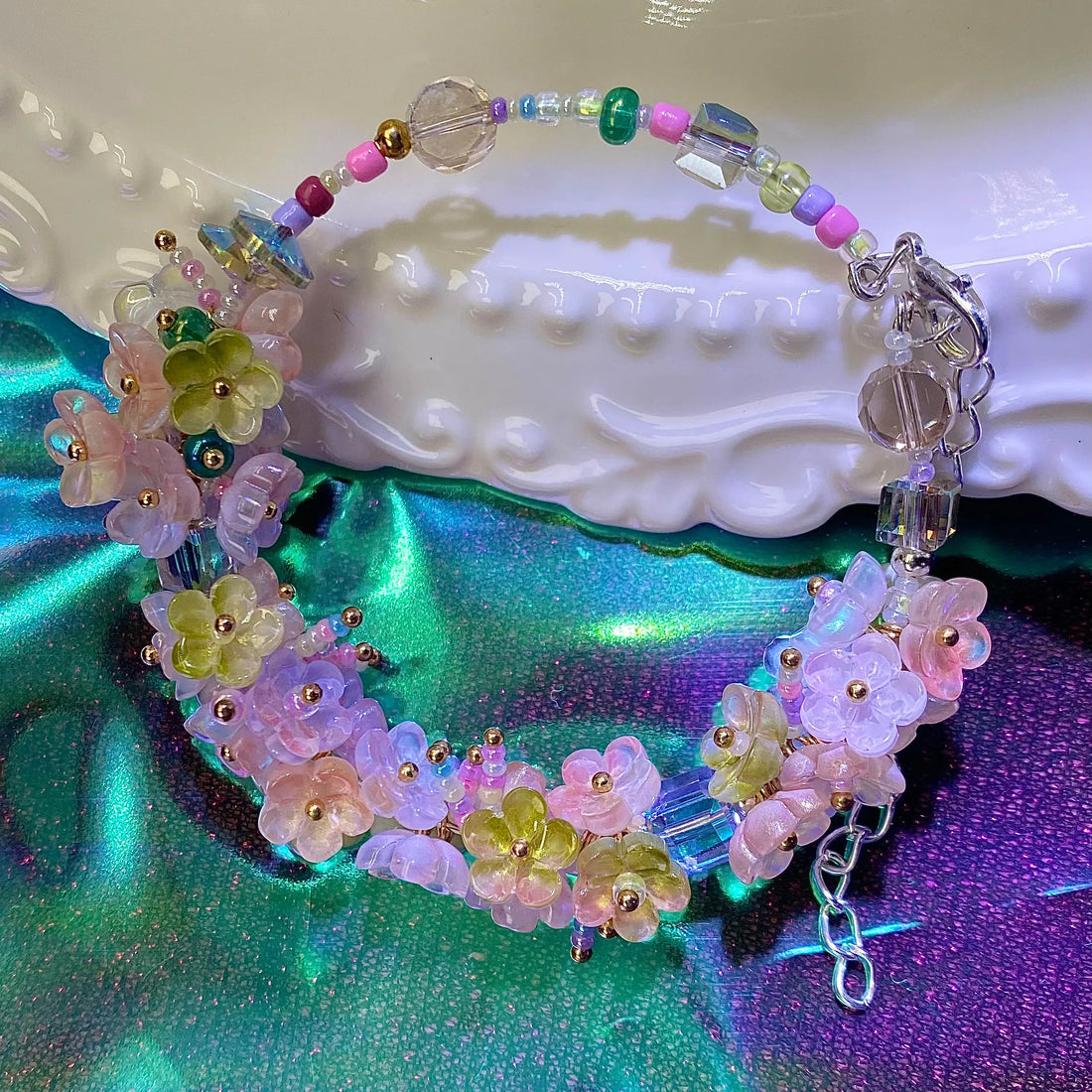 The refraction of sunlight through the cracks of the beads dances across the tabletop - that's the magic of DIY beading.